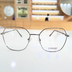 Lunettes de vue hexagonales argentées à monture fine en métal brillant, branches droites avec embouts, style élégant.