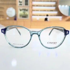 Vue de face de lunettes femme rondes bleu clair, monture plastique brillante avec branches larges et charnières visibles.