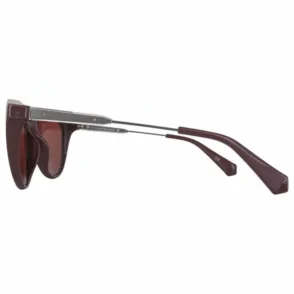 Calvin Klein lunette de soleil marron avec branches en métal, manchons bruns solides et verres teintés.