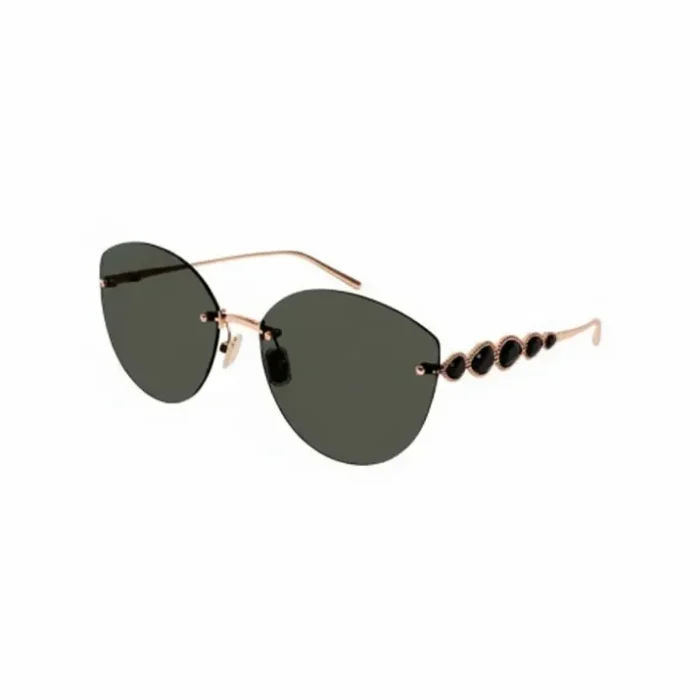 Lunette de soleil Boucheron femme dorée luxe Lunette de soleil Boucheron femme à monture fine dorée, verres ovales noirs et branches ornées de pierres noires en forme de larmes.