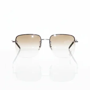 Lunette de soleil YSL homme avec monture fine en métal et verres teintés dégradés marron vers transparent, style luxe.