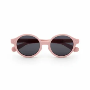 Lunette de soleil enfant avec monture ronde rose pâle, verres foncés et branches courtes et épaisses.