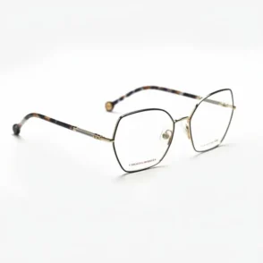 Carolina Herrera lunettes de vue à monture fine en métal doré, forme hexagonale, branches dorées et embouts écaille.