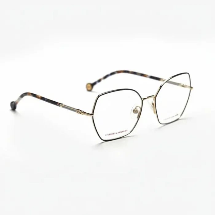 Carolina Herrera lunettes de vue à monture fine en métal doré, forme hexagonale, branches dorées et embouts écaille.