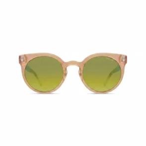 Komono lunettes de soleil à monture ronde épaisse marron translucide avec verres verts teintés et logo sur le verre.
