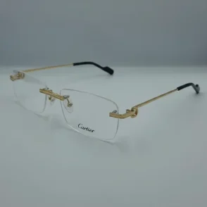 Lunette Cartier homme de vue en métal doré sans cerclage, branches fines avec embouts noirs et plaquettes ajustables.