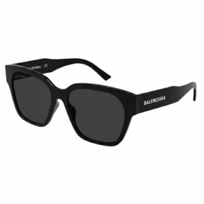 Lunette de soleil Balenciaga avec monture épaisse noire, verres carrés sombres et logo Balenciaga sur les branches.