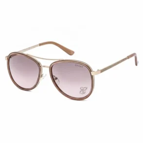 Lunette de soleil Guess femme style aviateur, monture métallique dorée et verres mauves avec plaquettes de nez ajustables.