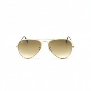Lunette de soleil Ray Ban femme style aviateur, monture métallique dorée et verres dégradés bruns avec logo Ray-Ban.