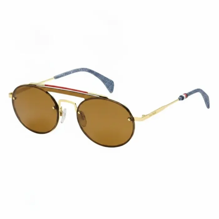 Lunette de soleil Tommy Hilfiger femme avec verres marron ronds, monture métal doré et barre supérieure rouge, branches bleues.