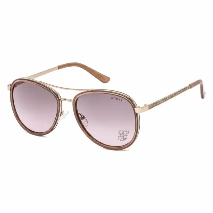 Lunette de soleil femme Guess style aviateur, monture métal dorée et verres roses dégradés avec plaquettes silicone.