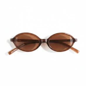Lunette de soleil femme H&M avec verres marron, monture ovale marron foncé en plastique et branches fines courbées.