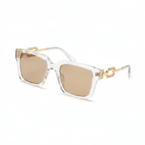 Lunette de soleil femme Jumia à monture épaisse transparente dorée, verres rectangulaires teintés et charnières visibles.
