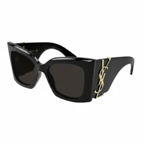 Lunette de soleil femme Yves Saint Laurent à monture épaisse noire, verres rectangulaires teintés foncés et détail doré.