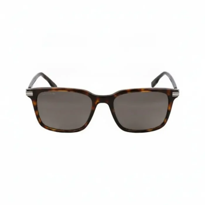 Lunette de soleil homme Lacoste écaille rectangulaire Lunette de soleil homme Lacoste à monture plastique écaille foncée, verres teintés sombres, forme rectangulaire avec détails métal argenté.