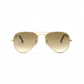 Lunette de soleil homme Ray Ban aviateur en métal doré avec verres marron dégradé et branches fines.