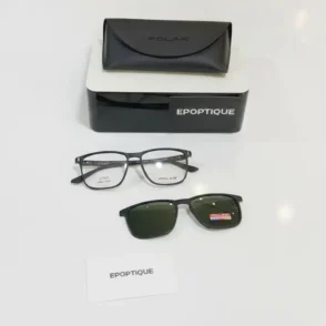 Lunette de soleil polar POLAR noire à verres foncés, avec étui noir POLAR et boîte EPOPTIQUE en arrière-plan.
