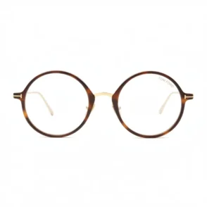 Lunette de vue Tom Ford femme à monture ronde écaille marron/noir, pont métal doré et branches fines avec détail en T.