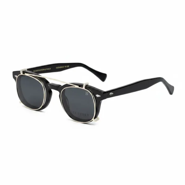 Monture lunette avec clip solaire en plastique noir, branches épaisses et clip teinté foncé fixé par un cadre métal.